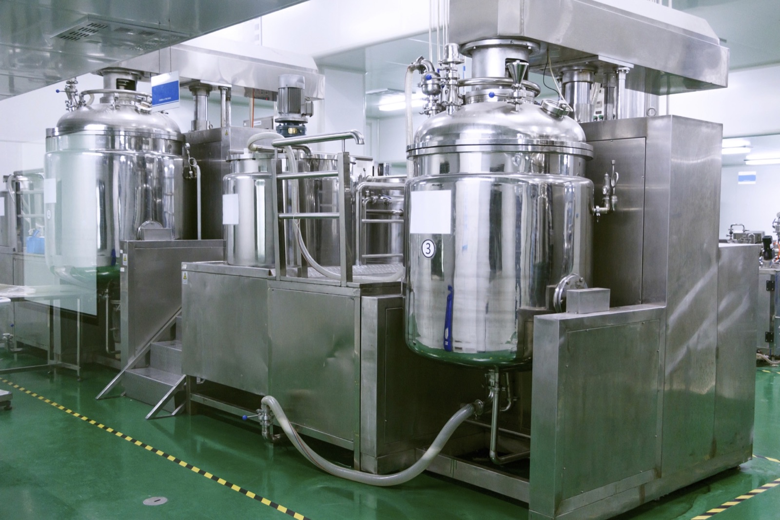 Stainless-steel process and mixing tanks in a food and beverage plant